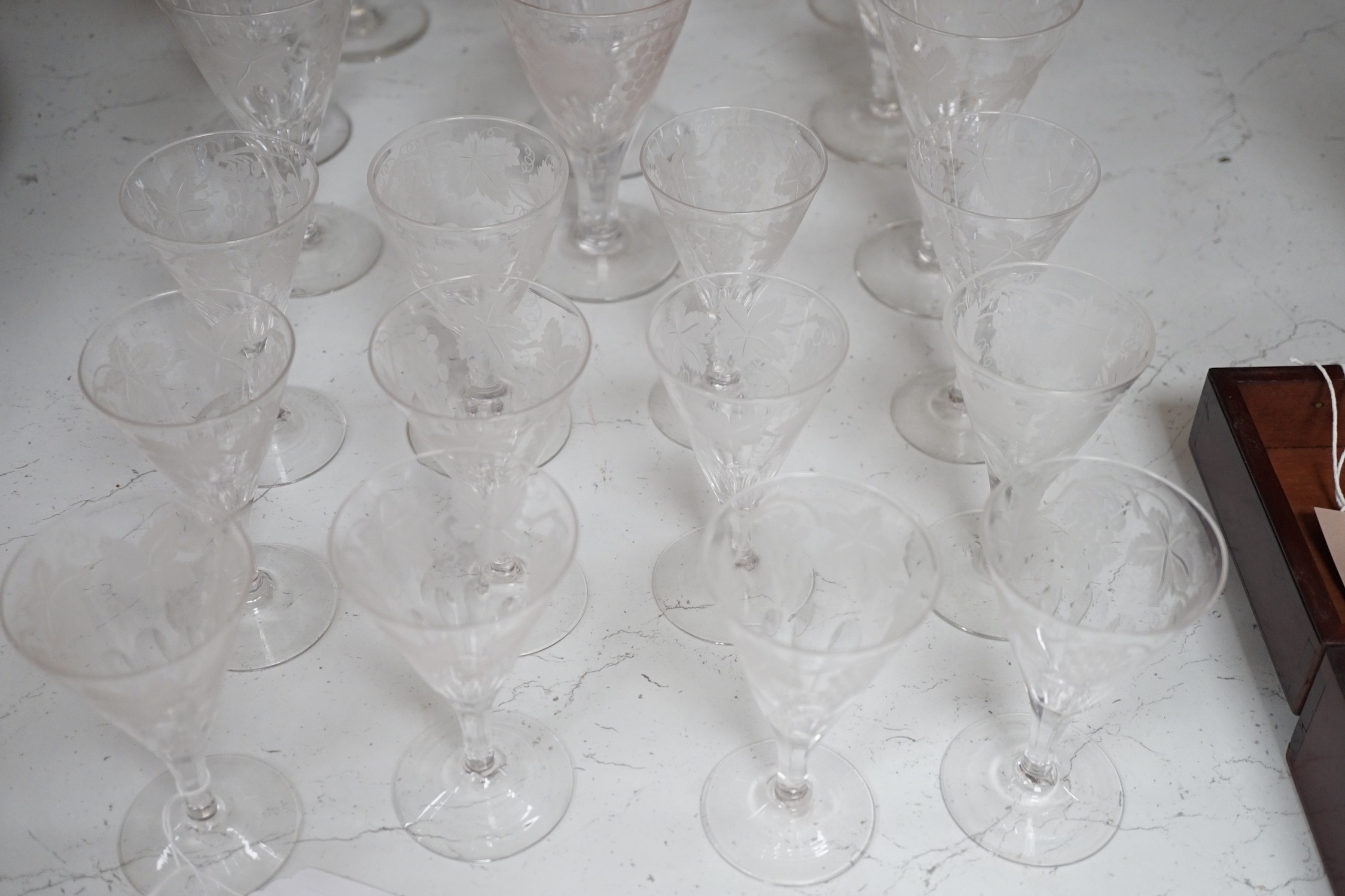 A part suite of Edwardian vineous etched glasses. Tallest 15cm